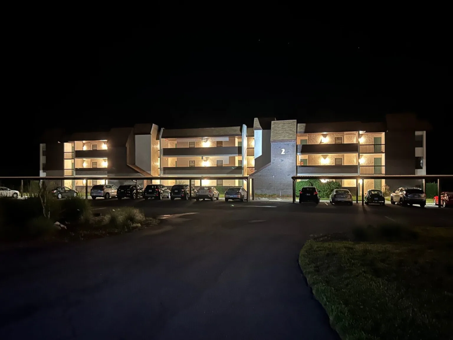Building 2 at night, new walkway lights beautifully illuminate the building.